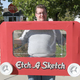 Image for article titled Working Etch-a-Sketch Costume Really Lets You Draw Boobies on This Guy